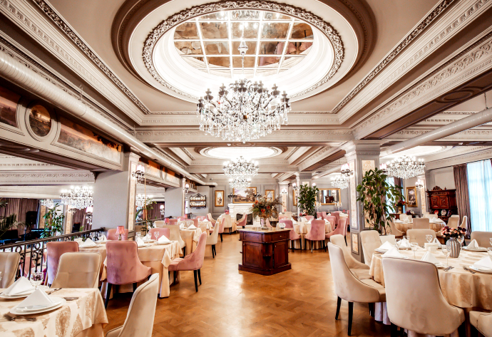 restaurant-hall-with-round-square-tables-some-chairs-plants
